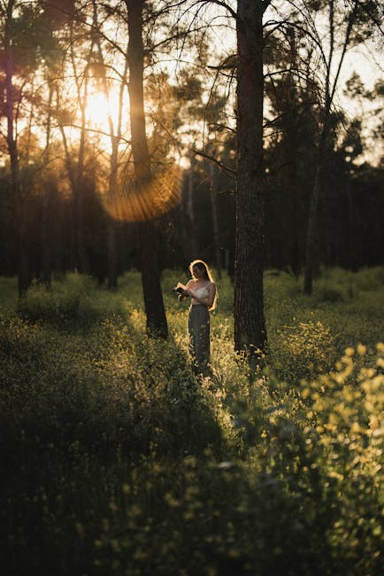 A woman meditating in a calm home environment at sunset